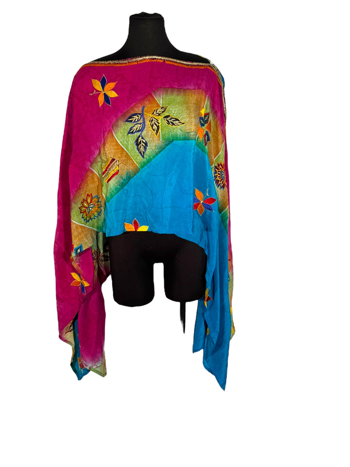 Sideways view of vintage silk Willow Wrap in blue and pink with  colorful floral emboidery 