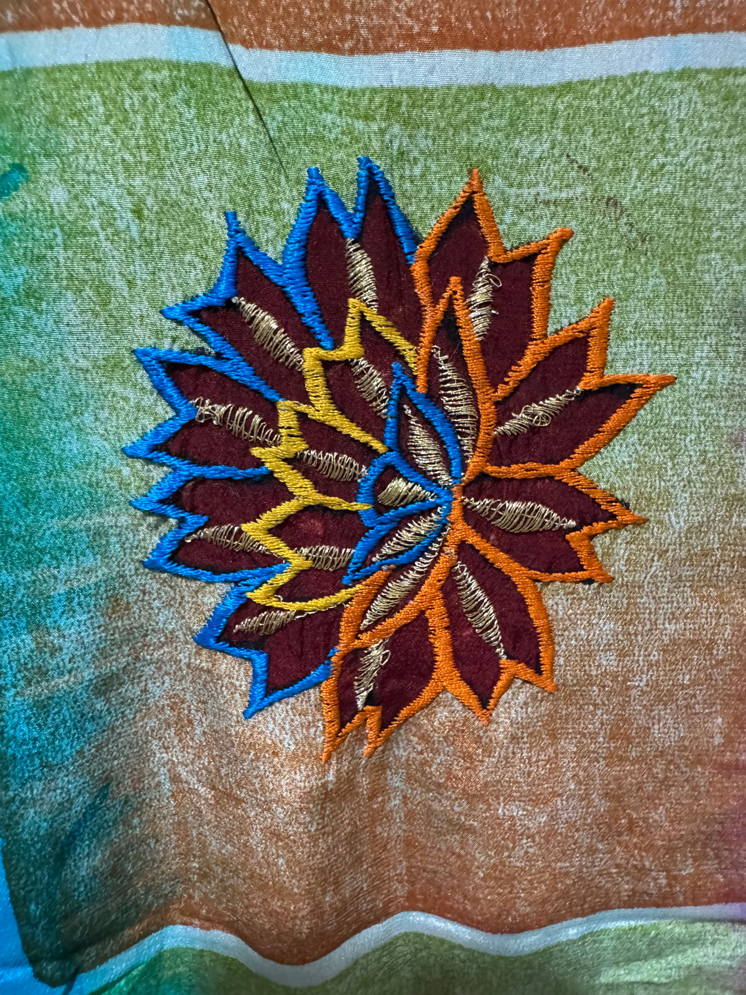 Detail view of vintage silk Willow Wrap in blue and pink with  colorful floral emboidery 