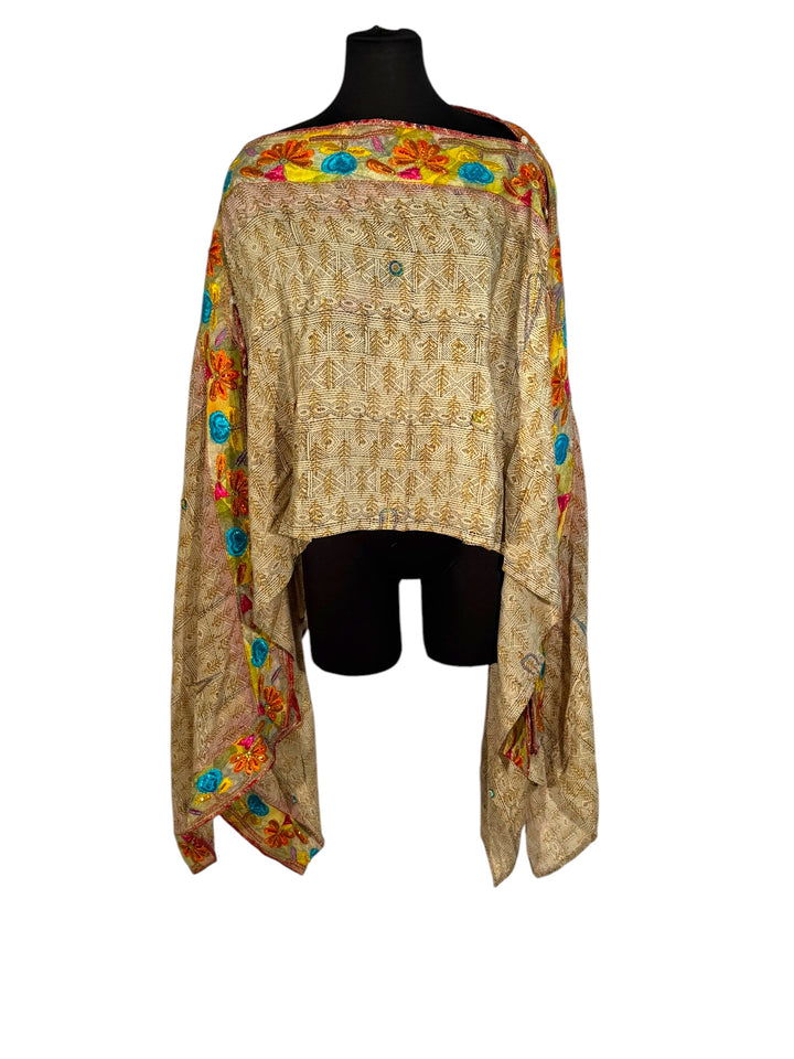 Sideways view of vintage silk Willow Wrap in tan print and intricate floral emboidered border