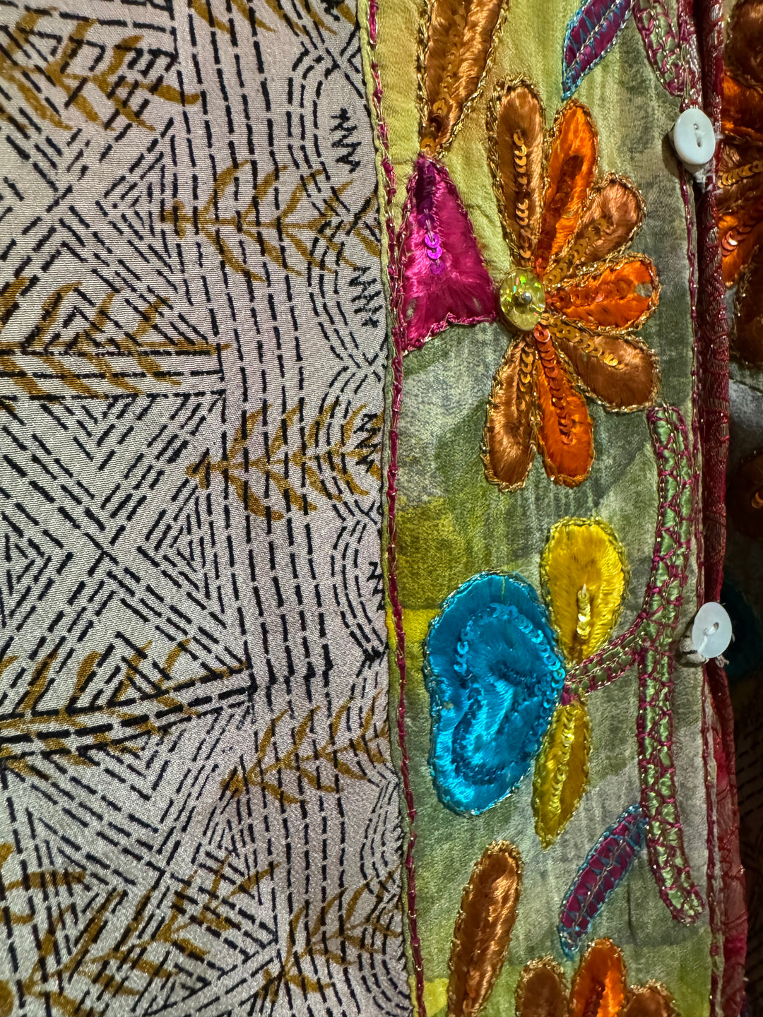 Detail view of vintage silk Willow Wrap in tan print and intricate floral emboidered border
