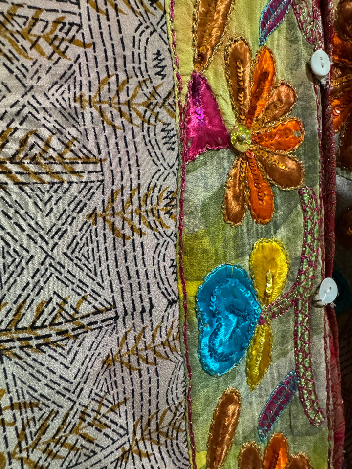 Detail view of vintage silk Willow Wrap in tan print and intricate floral emboidered border