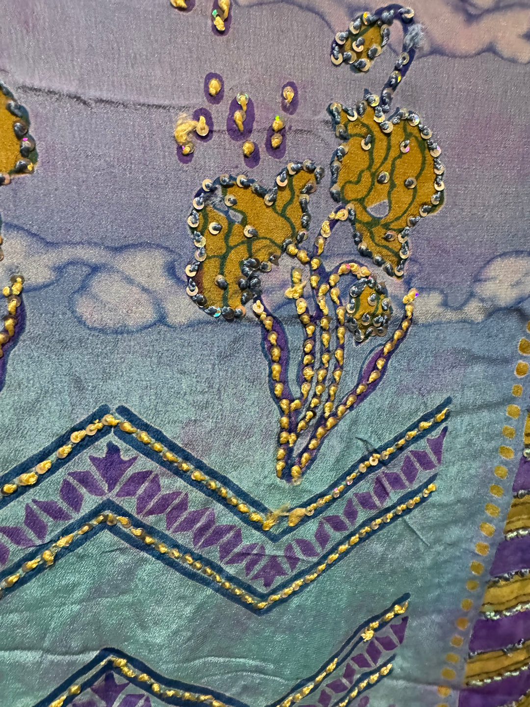 Detail view of vintage silk Willow Wrap in blue and lavender with gold sttipes and clouds and sequins