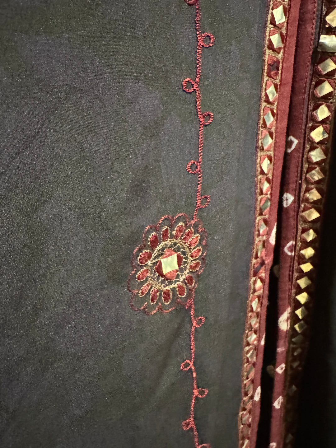 Detail view of vintage silk Willow Wrap in navy blue  with red embroidery and trim and mirroring