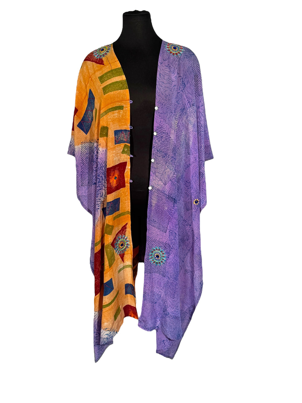 Back view of vintage silk Willow Wrap in orange  and purple with geometric print and large floral embroidery with rhinestones