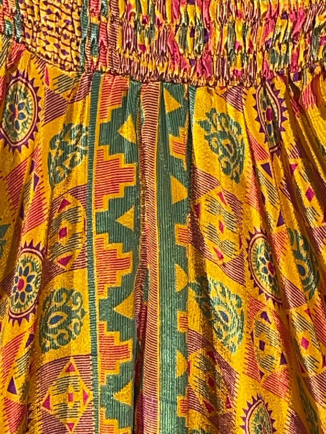 Close up view of yellow, red and green sustainable silk blend