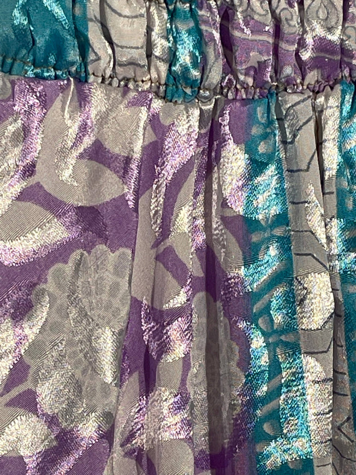 Close up of purple, cream and teal silk blend